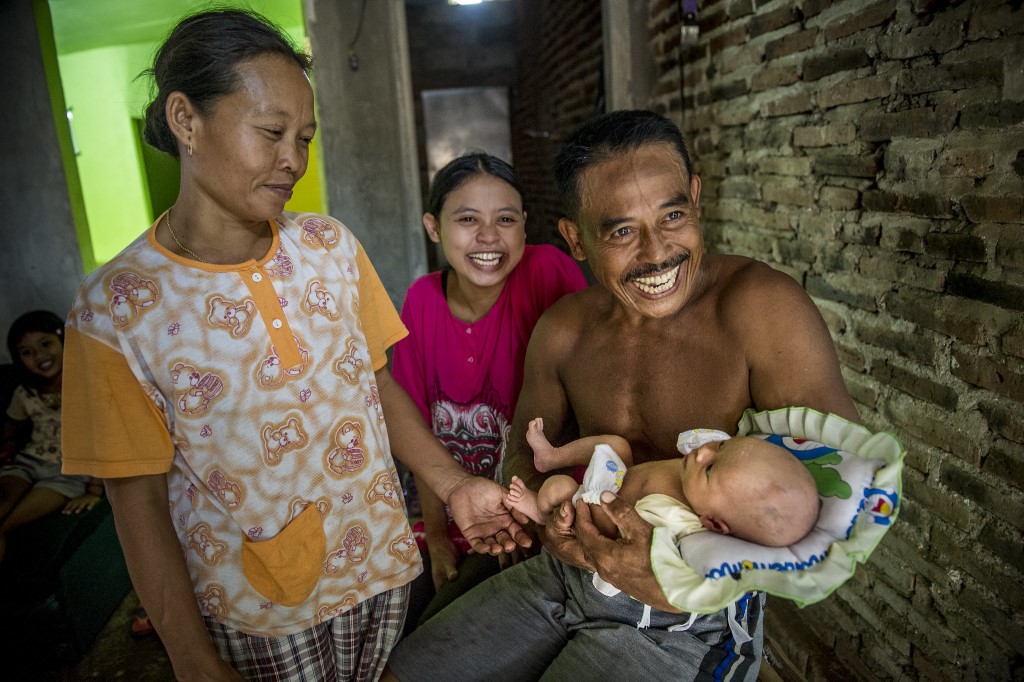 Family in Indonesia with newborn baby